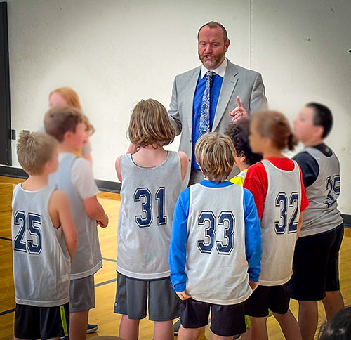 Brad coaching youth basketball